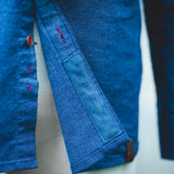 Lens cleaning microfiber on inside of blue dress shirt.