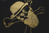 Toxic Masculinity logo in black and gold.