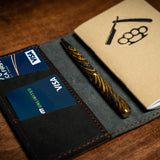 Handcrafted Notebook Wallet - Black Leather Goods Savage Gentleman. Thjis expedition wallet will hold credit cards, and a notebook. It's crafted from premium cowhide leather. Made in the USA. 
