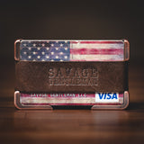 Copper wallet with brown leather strap and American flag credit card.