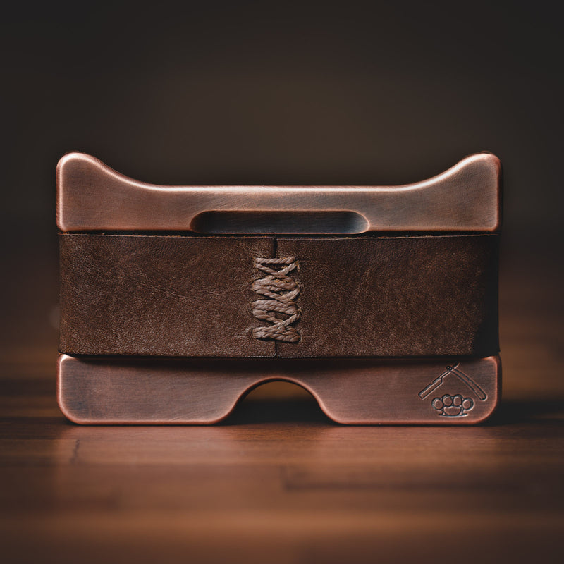Antiqued copper minimalist wallet with hand-sewn vintage brown leather strap.